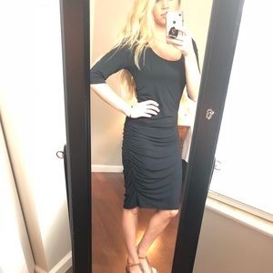 Black midi dress with side ruching.